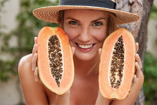 Woman holding papaya